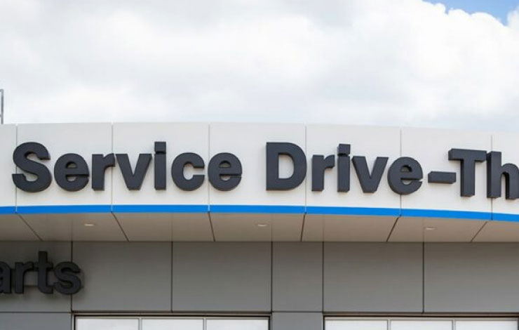 Image of service drive-thru entrance at a dealership.