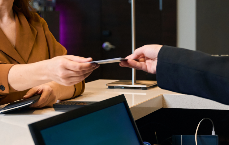 Woman handing ID to dealer