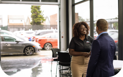 Image of Account Executive and Dealer shaking hands.