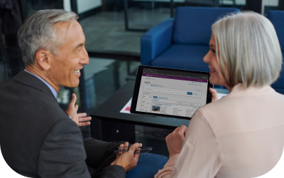 Image of Account Executive and Dealer looking at a computer.